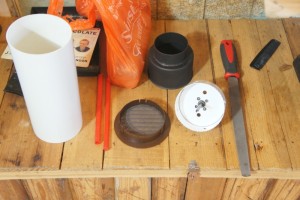 the tools needed to install the flexible hose and pipe through the cavity wall.