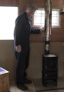 installing a tiny wood stove in a shed