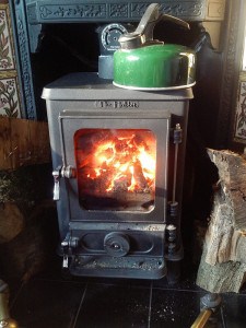 Small Stove Installed in a Household Fireplace