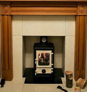 Small Stove Installed in a Household Fireplace