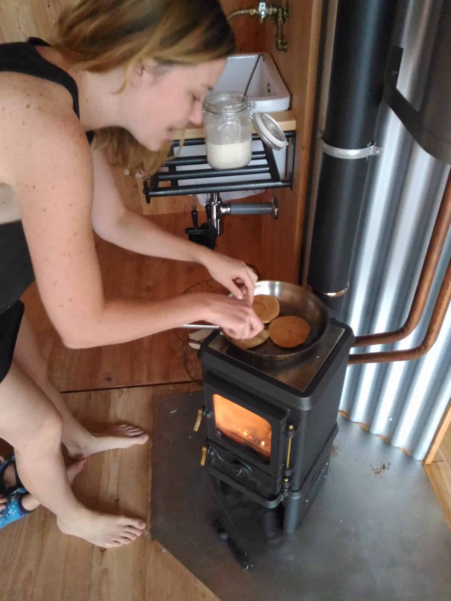 cooking on a small wood cookstove