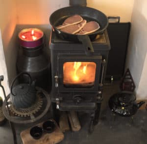 cooking on a small wood cookstove