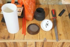 the tools needed to install the flexible hose and pipe through the cavity wall.