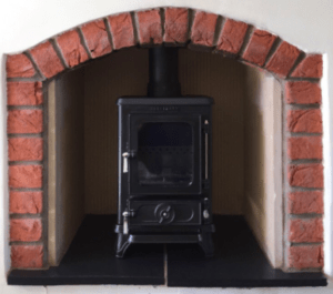 Small Stove Installed in a Small Fireplace