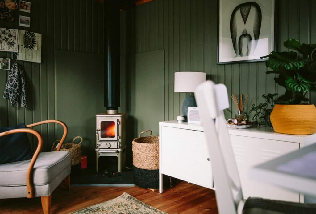 small log burner installed in a garden room office 3