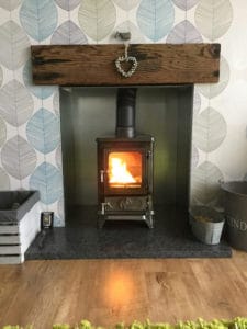small stove in a small fireplace