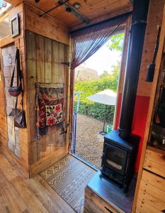 small wood burning stove in a converted removals lorry campervan