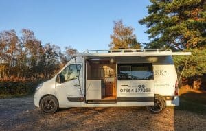 small wood burning stove in a renault master conversion