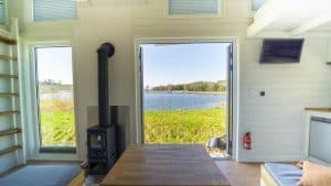 small wood burning stove installed in a tiny home mobi house 6