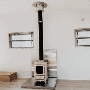small wood burning stove installed in an airstream
