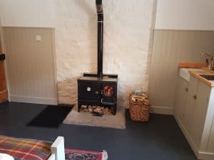 small wood burning cook stove installed in a scottish bothy 3