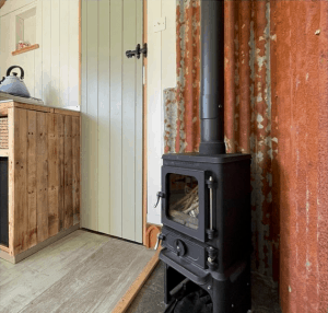 small wood burning stove installed in a shepherds hut in yorkshire