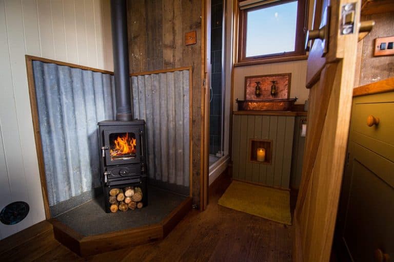 small wood burning stove intalled in a shepherds hut