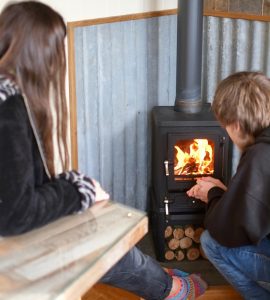 small wood burning stove intalled in a shepherds hut