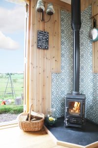 the hobbit small wood burning stove installed in a shepherds hut westfield house farm