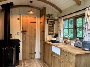 small wood burning stove installed in a shepherd's hut in chagford