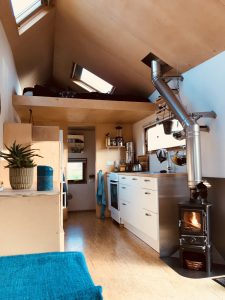 Small Wood Burning Stove Installed In A Netherlands Tiny Home On Wheels