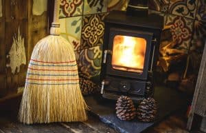 Hobbit small wood burning stove installed in a log cabin Hesleyside Huts Rowan 2