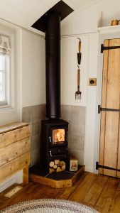 The Hobbit small wood burning stove installed in a shepherds hut Old Tinny Stamford Cider Huts 11