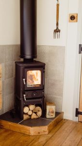 The Hobbit small wood burning stove installed in a shepherds hut Old Tinny Stamford Cider Huts 12