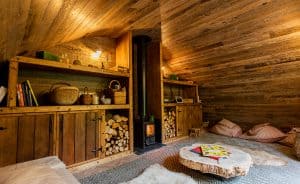Hobbit small wood burning stove installed in a cabin designed by Blue Forest 1