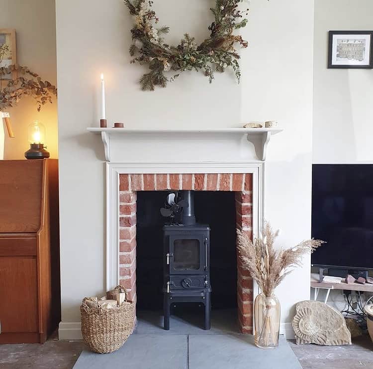 Hobbit small wood burning stove installed in a small household fireplace Beresford Project 5