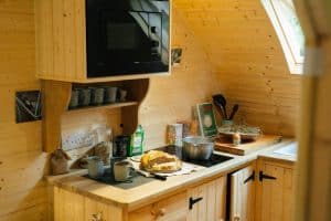 The Hobbit small wood burning stove installed in a log cabin in Wales 9