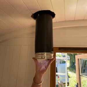 Salamander Stoves Inserting Flue Through Shepherd's Hut Ceiling