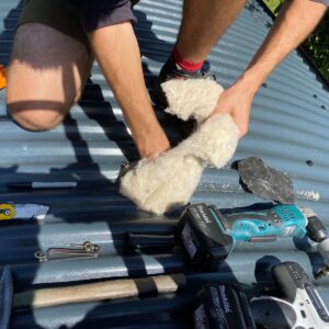 Salamander Stoves Installing a Wood Burner into a Shepherd's Hut Removing Sheep Wool Insulation